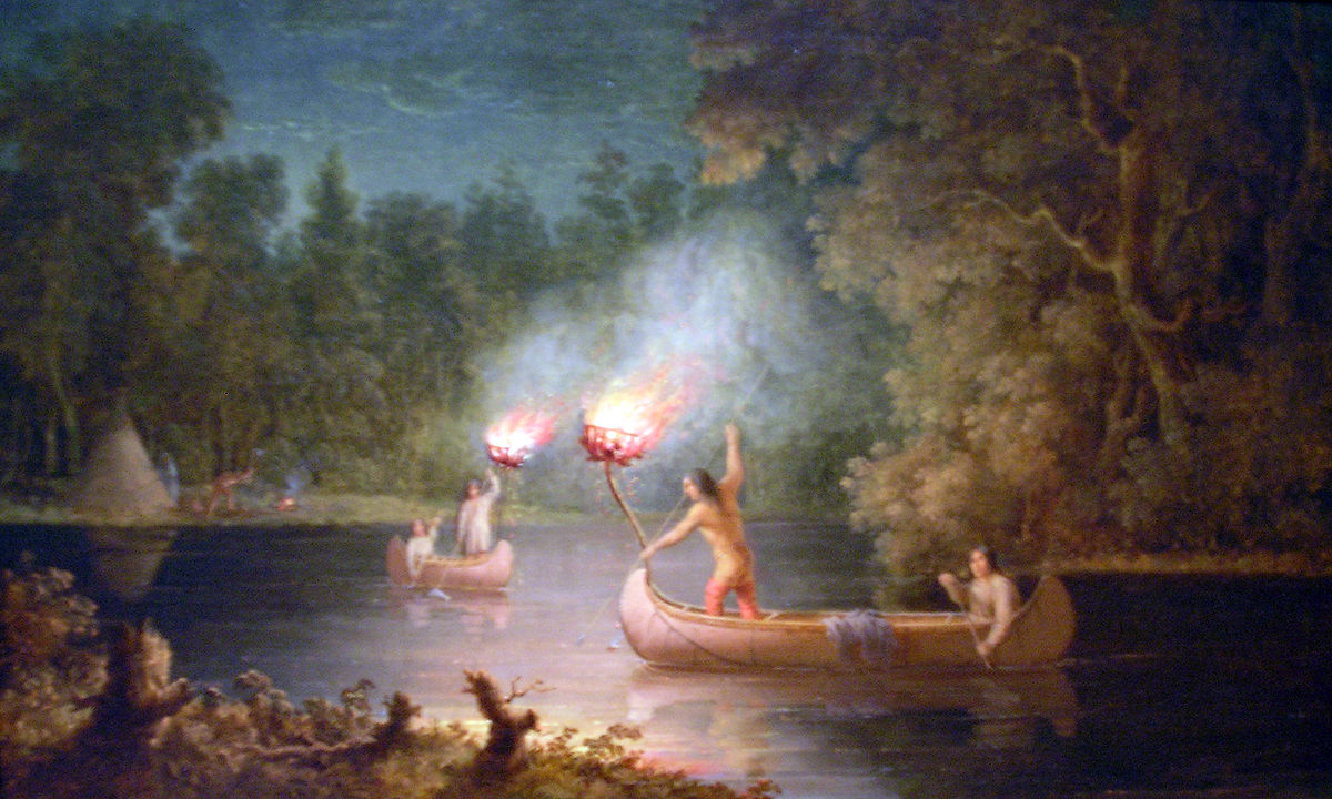 Canoës d'Amérindiens en pêche nocturne à la torche