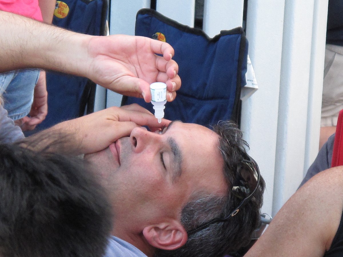 Man taking eyedrops.jpg