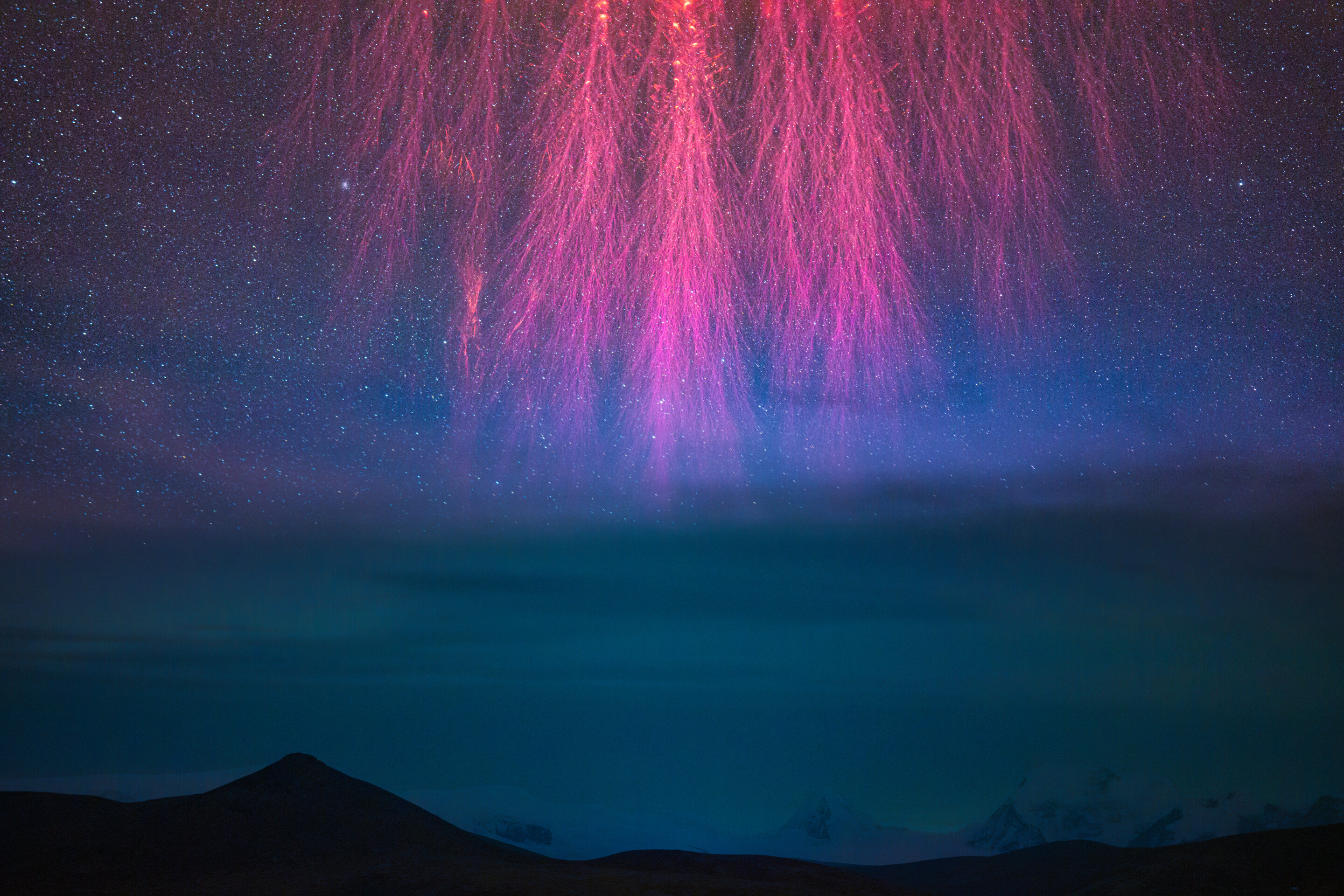 What are these strange red flashes photographed above the Himalayas? ⚡